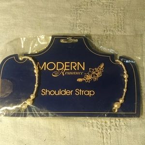 Beaded shoulder strap.